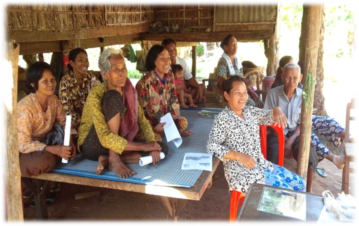 Cambodian farmers listening to a discussion.